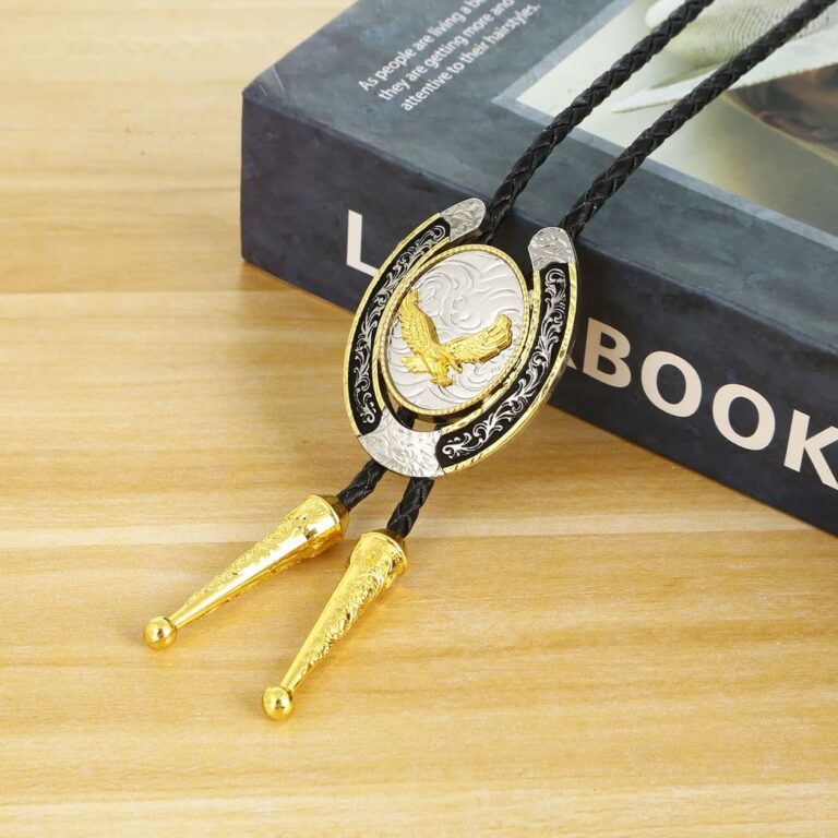 Two Tone Gold Landing Eagle Silver Horseshoe Bolo Tie With Intricate Detailing Hanging On A Black Leather Bootlace Cord